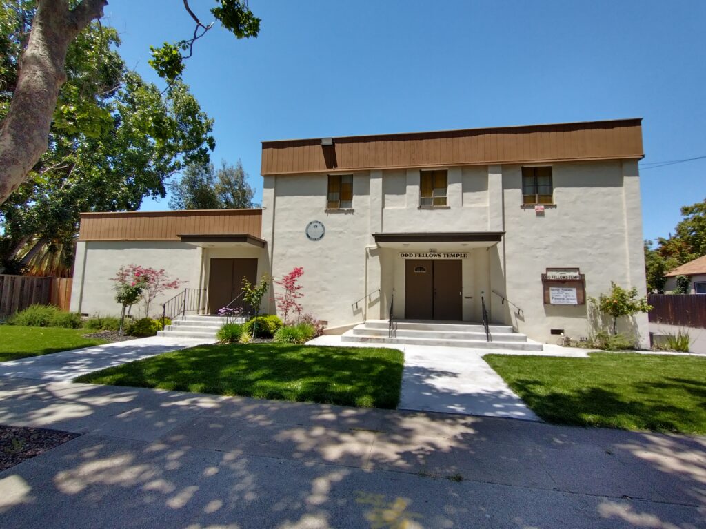 exterior of lodge in daylight, with grounds visible