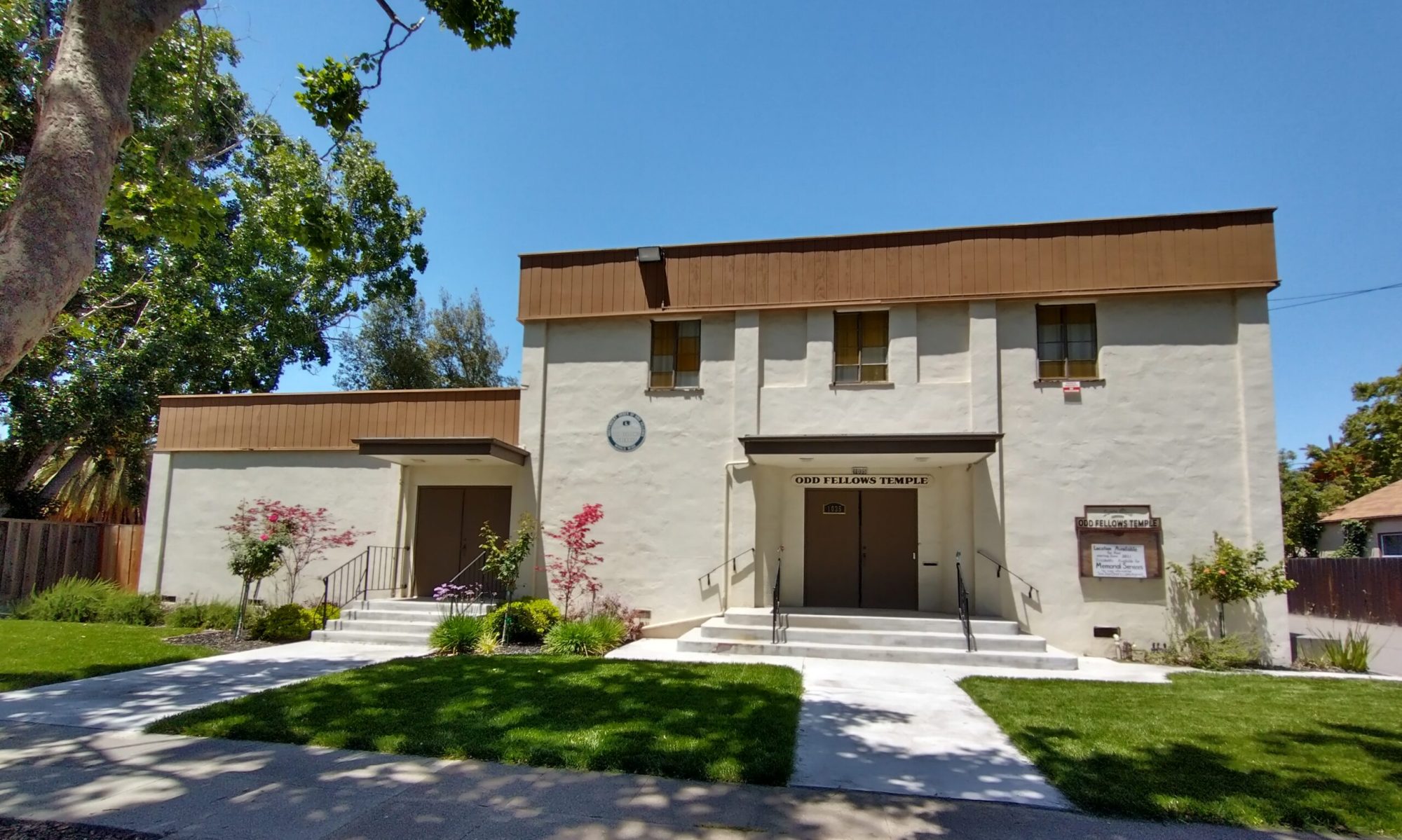 exterior of lodge in daylight, with grounds visible