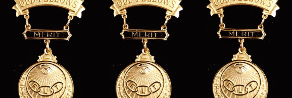 Three badges of merit on a black background
